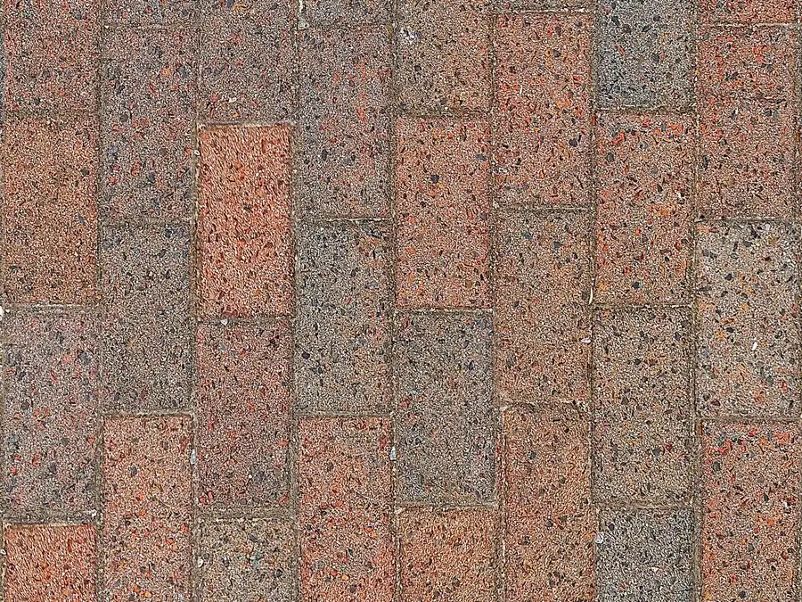 Close-up of block paving bricks laid in a red and grey pattern