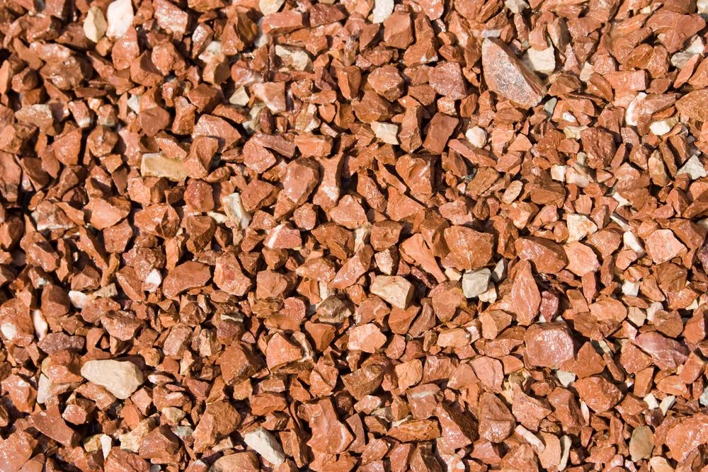 Close-up of red and terracotta-toned stone chippings