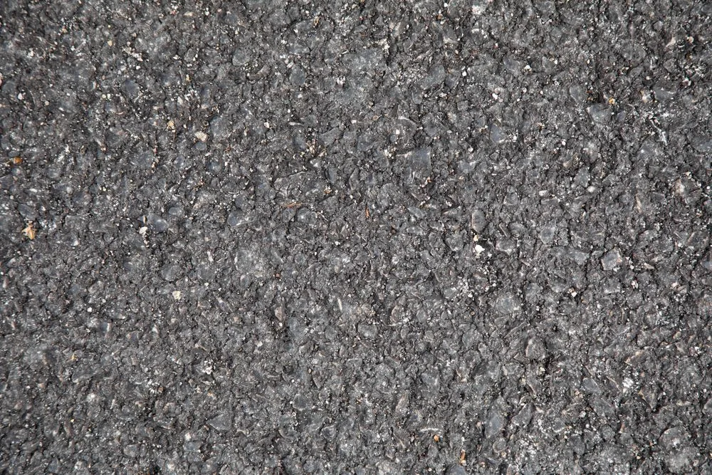 Close-up of a dark asphalt surface texture